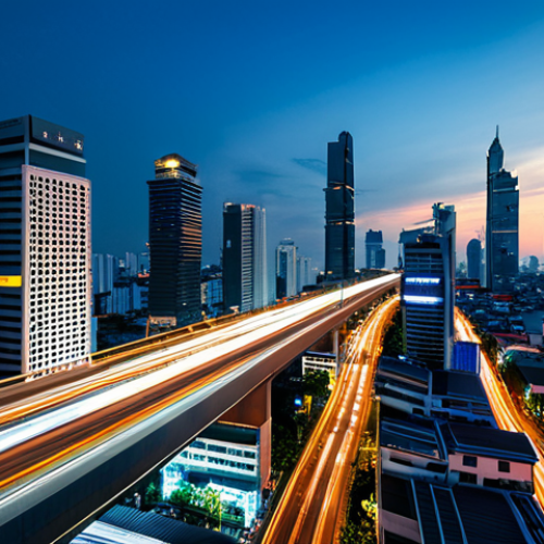A professional wide-angle shot of a futuristic Thai cityscape at dusk, highlighting advanced digital infrastructure. Sleek, modern high-rise buildings with integrated smart technology are visible, featuring subtle glowing data lines connecting structures and smart streetlights illuminating the roads. Public digital information displays show real-time urban data. In the foreground, a diverse group of fully clothed people, dressed in professional and modest contemporary Thai attire, are seen moving through the bustling scene. The atmosphere is vibrant and efficient, showcasing a technologically advanced urban environment. Professional photography, high resolution, intricate details, perfect anatomy, correct proportions, natural pose, well-formed hands, proper finger count, natural body proportions, safe for work, appropriate content, fully clothed, professional, family-friendly.